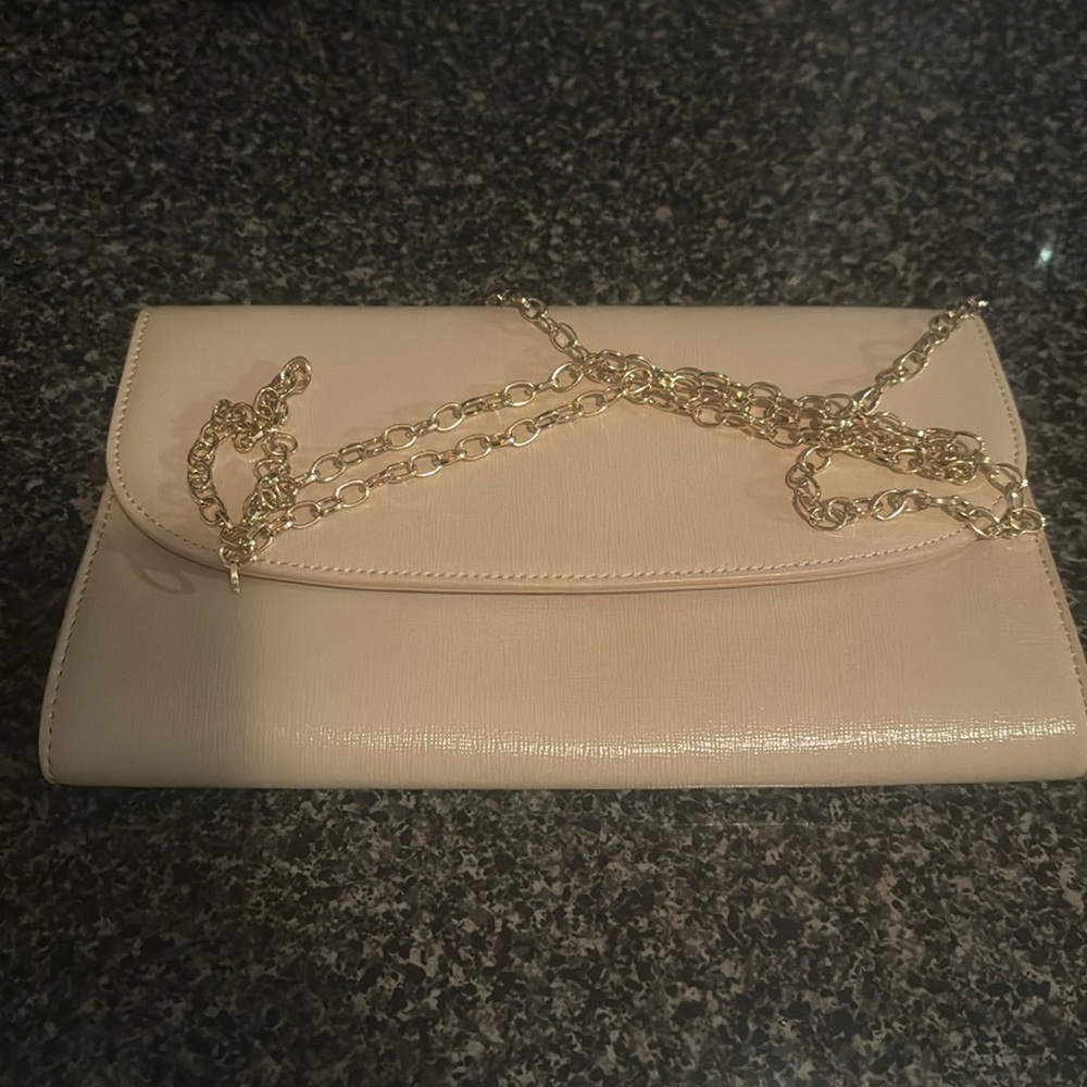 Nordstroms cream envelope purse with gold chain link strap